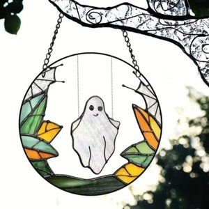 Spook Up Your Home with this Plastic Halloween Ghost on a swing Suncatcher!